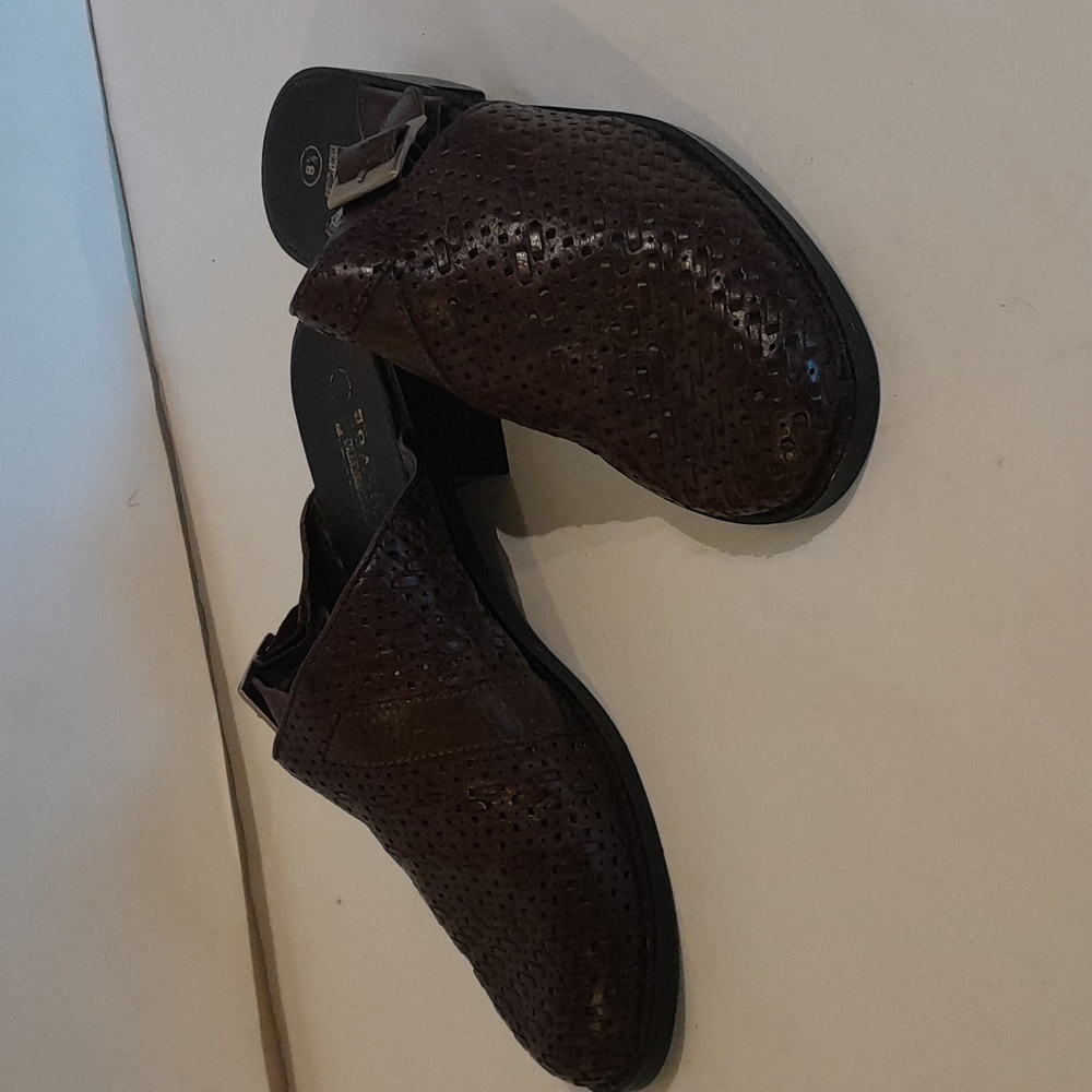 This is a brown leather mule shoe.